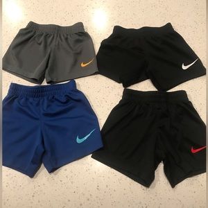 Nike Sporty shorts size 18M-2T, includes 4 pairs